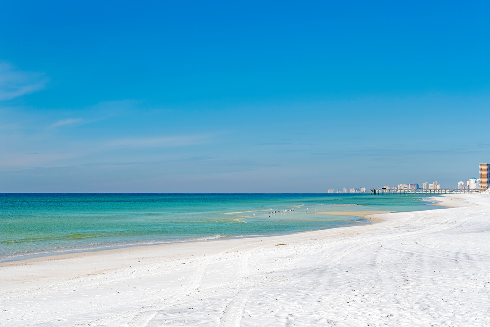 White sands of Panama City Beach on a sunny vacation day